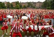 26 August 2022; Nebraska Cornhuskers cheerleaders and supporters during the pep-rally at Merrion Square in Dublin ahead of the the Aer Lingus College Football Classic 2022 match between Northwestern Wildcats and Nebraska Cornhuskers. Photo by David Fitzgerald/Sportsfile