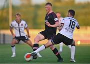 26 August 2022; Eoin Farrell of Wexford in action against Robbie McCourt of Dundalk during the Extra.ie FAI Cup second round match between Wexford and Dundalk at Ferrycarrig Park in Wexford. Photo by Ben McShane/Sportsfile