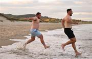 26 August 2022; Ed Byrne and Jack Conan during a swim on day two of the Leinster Rugby 12 Counties Tour at Brittas Bay in Wicklow. Photo by Harry Murphy/Sportsfile
