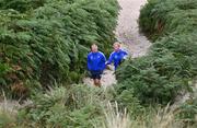 26 August 2022; Senior coach Stuart Lancaster and head coach Leo Cullen during a swim on day two of the Leinster Rugby 12 Counties Tour at Brittas Bay in Wicklow. Photo by Harry Murphy/Sportsfile