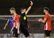 26 August 2022; Referee Kevin O'Sullivan shows a red card to Anthony McKay of Lucan United during the Extra.ie FAI Cup second round match between Lucan United and Bohemians at Dalymount Park in Dublin. Photo by Seb Daly/Sportsfile