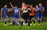 26 August 2022; Dylan Connolly of Lucan United reacts after teammate Anthony McKay is shown ared card by referee Kevin O'Sullivan during the Extra.ie FAI Cup second round match between Lucan United and Bohemians at Dalymount Park in Dublin. Photo by Seb Daly/Sportsfile