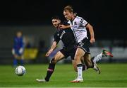 26 August 2022; Greg Sloggett of Dundalk in action against Harry Groome of Wexford during the Extra.ie FAI Cup second round match between Wexford and Dundalk at Ferrycarrig Park in Wexford. Photo by Ben McShane/Sportsfile