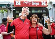 27 August 2022; Nebraska Cornhuskers supporters Rob and Mary Jackson from Harlan, Ioha, outside Buskers Bar during the pre-match tailgate at Temple Bar in Dublin ahead of the The Aer Lingus College Football Classic 2022 match between Northwestern Wildcats and Nebraska Cornhuskers. Photo by Sam Barnes/Sportsfile