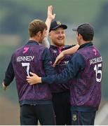 27 August 2022; CIYMS players, from left, Graham Kennedy, Jason van der Merve and Jacob Mulder celebrate winning the Clear Currency Irish Senior Cup Final match between Lisburn and CIYMS at Bready Cricket Club in Bready, Tyrone. Photo by Ramsey Cardy/Sportsfile
