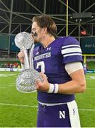 27 August 2022; Northwestern Wildcats quarterback Ryan Hilinski kisses the trophy after his side's victory in the Aer Lingus College Football Classic 2022 match between Northwestern Wildcats and Nebraska Cornhuskers at Aviva Stadium in Dublin. Photo by Brendan Moran/Sportsfile