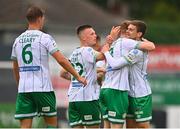 28 August 2022; Sean Gannon of Shamrock Rovers, right, celebrates with teammates, from left, Dan Cleary, Andy Lyons and Sean Hoare after scoring his side's first goal during the Extra.ie FAI Cup second round match between Drogheda United and Shamrock Rovers at Head in the Game Park in Drogheda, Louth. Photo by Ben McShane/Sportsfile