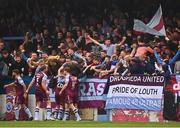 28 August 2022; Drogheda United players and supporters celebrate after their first goal, scored by Dean Williams, hidden, during the Extra.ie FAI Cup second round match between Drogheda United and Shamrock Rovers at Head in the Game Park in Drogheda, Louth. Photo by Ben McShane/Sportsfile