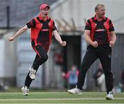 28 August 2022; Sean Sludds of North County, left, and teammate Eddie Richardson celebrate during the Clear Currency National Cup Final match between North County and Terenure at Leinster Cricket Club in Dublin. Photo by Piaras Ó Mídheach/Sportsfile