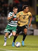 25 August 2022; Henry Wingo of Ferencváros in action against Aaron Greene of Shamrock Rovers during the UEFA Europa League Play-Off Second Leg match between Shamrock Rovers and Ferencvaros at Tallaght Stadium in Dublin. Photo by Seb Daly/Sportsfile