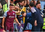 28 August 2022; Dayle Rooney of Drogheda United in conversation with Drogheda United manager Kevin Doherty, right, after being substituted off during the Extra.ie FAI Cup second round match between Drogheda United and Shamrock Rovers at Head in the Game Park in Drogheda, Louth. Photo by Ben McShane/Sportsfile