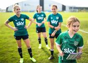 29 August 2022; FAI guest Zara Foley, age 10, from Ballinteer, Dublin, with players, from left, Denise O'Sullivan, Lucy Quinn and Jess Ziu during a Republic of Ireland Women training session at the FAI National Training Centre in Abbotstown, Dublin. Photo by Stephen McCarthy/Sportsfile