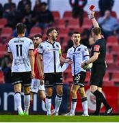 29 August 2022; Darragh Leahy of Dundalk, second from right, is shown a red card by referee John McLoughlin during the SSE Airtricity League Premier Division match between Sligo Rovers and Dundalk at The Showgrounds in Sligo. Photo by Ben McShane/Sportsfile