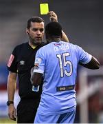 29 August 2022; Referee Rob Clarke shows the yellow card to Sadou Diallo of Derry City during the SSE Airtricity League Premier Division match between Shelbourne and Derry City at Tolka Park in Dublin. Photo by Piaras Ó Mídheach/Sportsfile