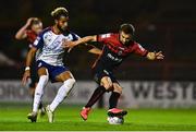 29 August 2022; Tyreke Wilson of Bohemians in action against Barry Cotter of St Patrick's Athletic during the SSE Airtricity League Premier Division match between Bohemians and St Patrick's Athletic at Dalymount Park in Dublin. Photo by Eóin Noonan/Sportsfile