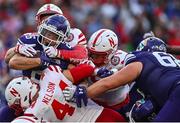 27 August 2022; Northwestern Wildcats running back Evan Hull is stopped by the Nebraska Cornhuskers defence during the Aer Lingus College Football Classic 2022 match between Northwestern Wildcats and Nebraska Cornhuskers at Aviva Stadium in Dublin. Photo by Brendan Moran/Sportsfile