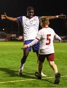 29 August 2022; Serge Atakayi of St Patrick's Athletic celebrates with a supporter after the SSE Airtricity League Premier Division match between Bohemians and St Patrick's Athletic at Dalymount Park in Dublin. Photo by Tyler Miller/Sportsfile