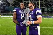 27 August 2022; Northwestern Wildcats defensive lineman Ryan Johnson, left, and quarterback Ryan Hilinski celebrate with the trophy after the Aer Lingus College Football Classic 2022 match between Northwestern Wildcats and Nebraska Cornhuskers at Aviva Stadium in Dublin. Photo by Brendan Moran/Sportsfile