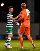 25 August 2022; Andy Lyons of Shamrock Rovers with Ádám Bogdán of Ferencváros after the UEFA Europa League Play-Off Second Leg match between Shamrock Rovers and Ferencvaros at Tallaght Stadium in Dublin. Photo by Eóin Noonan/Sportsfile