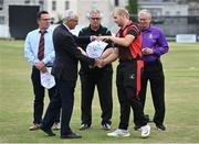 28 August 2022; Cricket Ireland president David Griffin makes a presentation to North County captain Eddie Richardson before the Clear Currency National Cup Final match between North County and Terenure at Leinster Cricket Club in Dublin. Photo by Piaras Ó Mídheach/Sportsfile