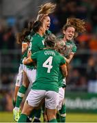 1 September 2022; Republic of Ireland players, including Louise Quinn, Jess Ziu, Denise O'Sullivan and Heather Payne celebrates with Lily Agg, hidden, after scoring their goal during the FIFA Women's World Cup 2023 qualifier match between Republic of Ireland and Finland at Tallaght Stadium in Dublin. Photo by Stephen McCarthy/Sportsfile