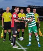 2 September 2022; Shamrock Rovers captain Ronan Finn presents wreath of flowers to Bohemians captain Conor Levingston, in memory of the late Bohemians supporter and volunteer Derek 'Mono' Monaghan, before the SSE Airtricity League Premier Division match between Bohemians and Shamrock Rovers at Dalymount Park in Dublin. Photo by Seb Daly/Sportsfile