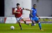 2 September 2022; Joe Redmond of St Patrick's Athletic in action against Eric McWoods of Finn Harps during the SSE Airtricity League Premier Division match between St Patrick's Athletic and Finn Harps at Richmond Park in Dublin. Photo by Eóin Noonan/Sportsfile