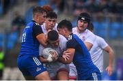 3 September 2022; Zac Soloman of Ulster is tackled by Jules Fenelon, left, and Luke Kritzinger of Leinster during the U19 Age-Grade Interprovincial Series match between Leinster and Ulster at Energia Park in Dublin. Photo by Ben McShane/Sportsfile