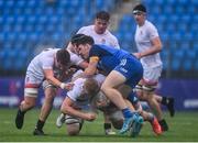 3 September 2022; Adam Motgomery of Ulster is tackled by Luke O'Connor, left, and Paul Wilson of Leinster during the U19 Age-Grade Interprovincial Series match between Leinster and Ulster at Energia Park in Dublin. Photo by Ben McShane/Sportsfile