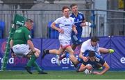 3 September 2022; Todd Lawlor of Leinster scores his side's fourth try despite the tackle of Josh Gibson of Ulster during the U18 Schools Age-Grade Interprovincial Series match between Leinster and Ulster at Energia Park in Dublin. Photo by Ben McShane/Sportsfile
