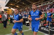 2 September 2022; John McKee, left, and Ross Byrne of Leinster run onto the pitch before the pre-season friendly match between Harlequins and Leinster at Twickenham Stoop in London, England. Photo by Brendan Moran/Sportsfile