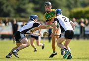 4 September 2022; Jack Ryan of Clonoulty-Rossmore in action against Kieran Cahill, left, and James Cleary of Kilruane MacDonaghs during the Tipperary County Senior Club Hurling Championship Round 2 match between Clonoulty-Rossmore and Kilruane MacDonaghs in Templetuohy, Tipperary. Photo by Seb Daly/Sportsfile