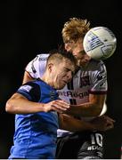 9 September 2022; Alex Nolan of UCD in action against Greg Sloggett of Dundalk during the SSE Airtricity League Premier Division match between UCD and Dundalk at UCD Bowl in Dublin. Photo by Seb Daly/Sportsfile