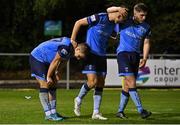 9 September 2022; Thomas Lonergan of UCD, left, celebrates with teammates Dylan Duffy, centre, and Alex Dunne after scoring their side's third goal during the SSE Airtricity League Premier Division match between UCD and Dundalk at UCD Bowl in Dublin. Photo by Seb Daly/Sportsfile