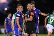 9 September 2022; Niall O'Keeffe of Waterford with referee Alan Patchell after he was shown a yellow card during the SSE Airtricity League First Division match between Waterford and Cork City at RSC in Waterford. Photo by Michael P Ryan/Sportsfile