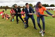 10 September 2022; Minister of State for Sport and the Gaeltacht Jack Chambers, TD, second from right, and Councillor JK Onwumereh, fourth from right, take part in a game of tug of war, alongside Hannele Raji, right, aged 13 from Drogheda, Louth, and players from Mosney FC in Meath, during the SARI Sportsfest at the Phoenix Park in Dublin, celebrating 25 years of working with sport to promote inclusion, diversity and equality. Photo by Sam Barnes/Sportsfile