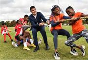 10 September 2022; Minister of State for Sport and the Gaeltacht Jack Chambers, TD, centre, takes part in a game of tug of war, alongside Hannele Raji, second from right, aged 13, and her sister Hila Raji, aged 10, both from Drogheda, Louth, and players from Mosney FC in Meath, during the SARI Sportsfest at the Phoenix Park in Dublin, celebrating 25 years of working with sport to promote inclusion, diversity and equality. Photo by Sam Barnes/Sportsfile