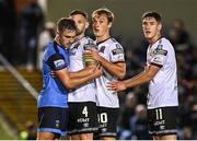9 September 2022; Evan Caffrey of UCD, with Dundalk players, from left, Andy Boyle, Greg Sloggett and John Martin during the SSE Airtricity League Premier Division match between UCD and Dundalk at UCD Bowl in Dublin. Photo by Seb Daly/Sportsfile