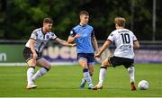 9 September 2022; Thomas Lonergan of UCD in action against Sam Bone, left, and Greg Sloggett of Dundalk during the SSE Airtricity League Premier Division match between UCD and Dundalk at UCD Bowl in Dublin. Photo by Seb Daly/Sportsfile