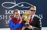 10 September 2022; Jockey Ryan Moore, left, and trainer Aidan O'Brien after winning the Royal Bahrain Irish Champion Stakes on Luxembourg, on day one of the Longines Irish Champions Weekend at Leopardstown Racecourse in Dublin. Photo by Seb Daly/Sportsfile