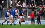 10 September 2022; James O'Donoghue of East Kerry in action against Ross O'Callaghan and Shane Brosnan of Kerins O'Rahillys during the Kerry County Senior Football Championship Round 1 match between Kerins O'Rahilly's and East Kerry at Austin Stack Park in Tralee, Kerry. Photo by Brendan Moran/Sportsfile