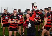 11 September 2022; Ballygunner supporter Nicky Daniels surrounded by the players celebrates with the cup after the Waterford County Senior Hurling Championship Final match between Mount Sion and Ballygunner at Walsh Park in Waterford. Photo by Sam Barnes/Sportsfile