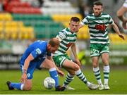 11 September 2022; Ryan Connolly of Finn Harps in action against Andy Lyons, left, and Jack Byrne of Shamrock Rovers during the SSE Airtricity League Premier Division match between Shamrock Rovers and Finn Harps at Tallaght Stadium in Dublin. Photo by Ramsey Cardy/Sportsfile