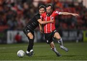 13 September 2022; Cameron Dummigan of Derry City in action against Robbie Burton of Sligo Rovers during the SSE Airtricity League Premier Division match between Derry City and Sligo Rovers at The Ryan McBride Brandywell Stadium in Derry. Photo by Ramsey Cardy/Sportsfile