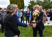 14 September 2022; Ireland team manager Michael Blake, second from right, and Team Ireland rider Cian O'Connor, right, are greeted by Mayor of Clare Tony O'Brien and Mayor of Tuamgraney Mary Coffey, as The Aga Khan trophy is brought to Tuamgraney, Clare, following Ireland's victory in the Longines FEI Jumping Nations Cup at the Dublin Horse Show. Photo by Sam Barnes/Sportsfile