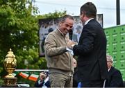 14 September 2022; Team Ireland rider Cian O'Connor, left, is interviewed by MC Brendan McArdle as the The Aga Khan trophy is brought to Tuamgraney, Clare, following Ireland's victory in the Longines FEI Jumping Nations Cup at the Dublin Horse Show. Photo by Sam Barnes/Sportsfile