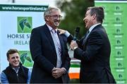 14 September 2022; Ireland team manager Michael Blake, left, is interviewed by MC Brendan McArdle as the The Aga Khan trophy is brought to Tuamgraney, Clare, following Ireland's victory in the Longines FEI Jumping Nations Cup at the Dublin Horse Show. Photo by Sam Barnes/Sportsfile