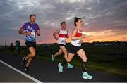 14 September 2022; Runners, from right, Edel Kelly, Adrian Hanley and Seamus Murphy competing in the Grant Thornton Corporate 5K Challenge at Claddagh in Galway. Photo by David Fitzgerald/Sportsfile