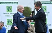14 September 2022; Horse Sport Ireland chairman Joe Reynolds, left, is interviewed by MC Brendan McArdle as The Aga Khan trophy is brought to Tuamgraney, Clare, following Ireland's victory in the Longines FEI Jumping Nations Cup at the Dublin Horse Show. Photo by Sam Barnes/Sportsfile