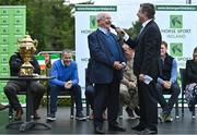 14 September 2022; Horse Sport Ireland chairman Joe Reynolds, left, is interviewed by MC Brendan McArdle as The Aga Khan trophy is brought to Tuamgraney, Clare, following Ireland's victory in the Longines FEI Jumping Nations Cup at the Dublin Horse Show. Photo by Sam Barnes/Sportsfile